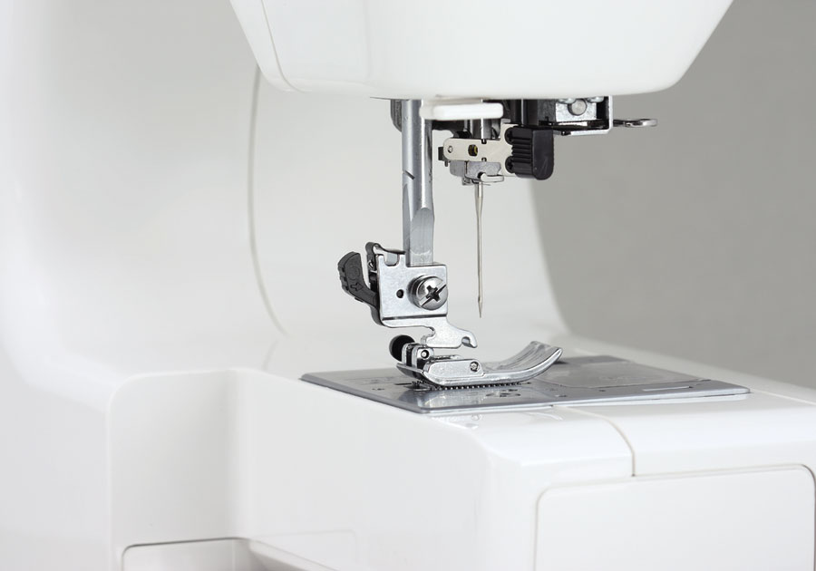 Janome Jem Gold Plus Portable Sewing Machine with Light Serging System